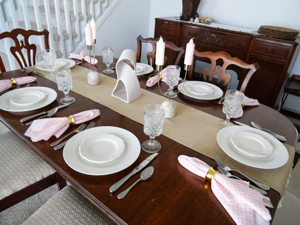 Full view of tablescape with pink and white accents.