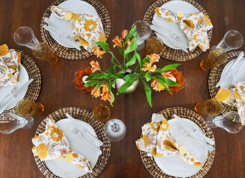 Overhead view of casual dinner party table setting.