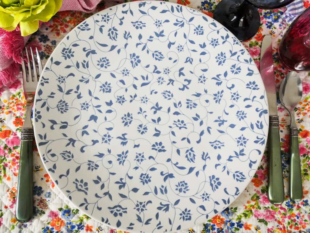 Blue and white dinner plate with flower pattern.