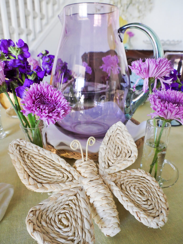 Close up of wicker butterfly on the lavender spring tablescape.