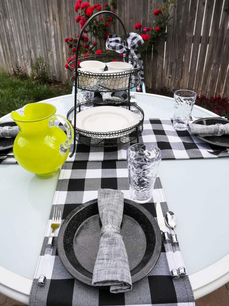 Vertical view of place setting to tiered-tray centerpiece.