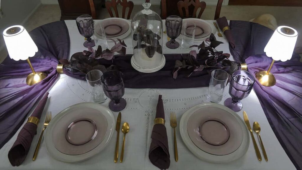 Unique fall table setting with portable lamps on each side.