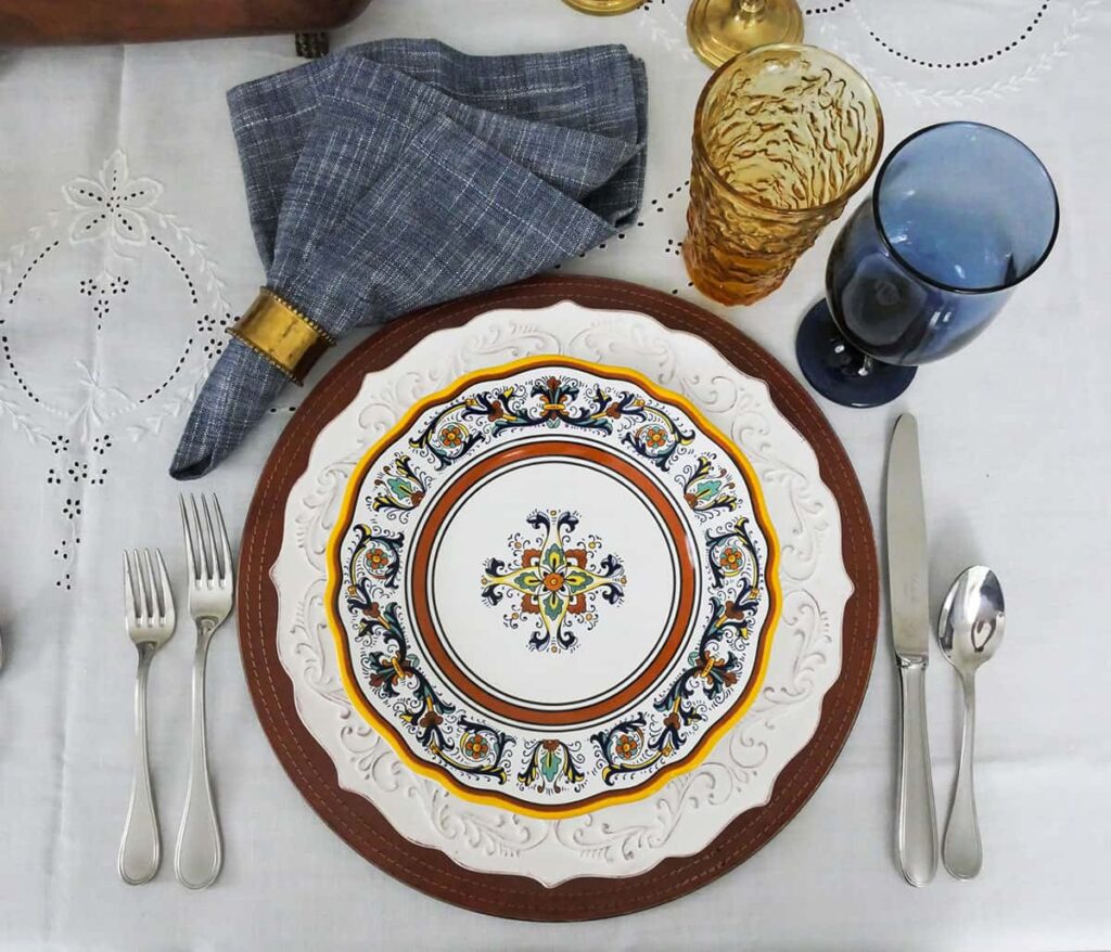 Overhead view of fall table setting showing the napkin at at angle in the upper left.