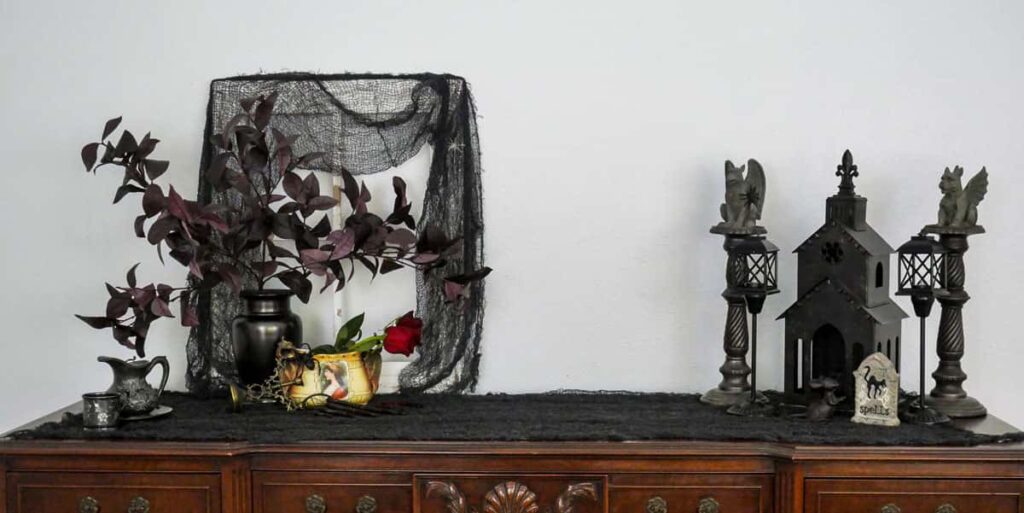 Buffet table styled for Halloween with spooky gothic vibes.