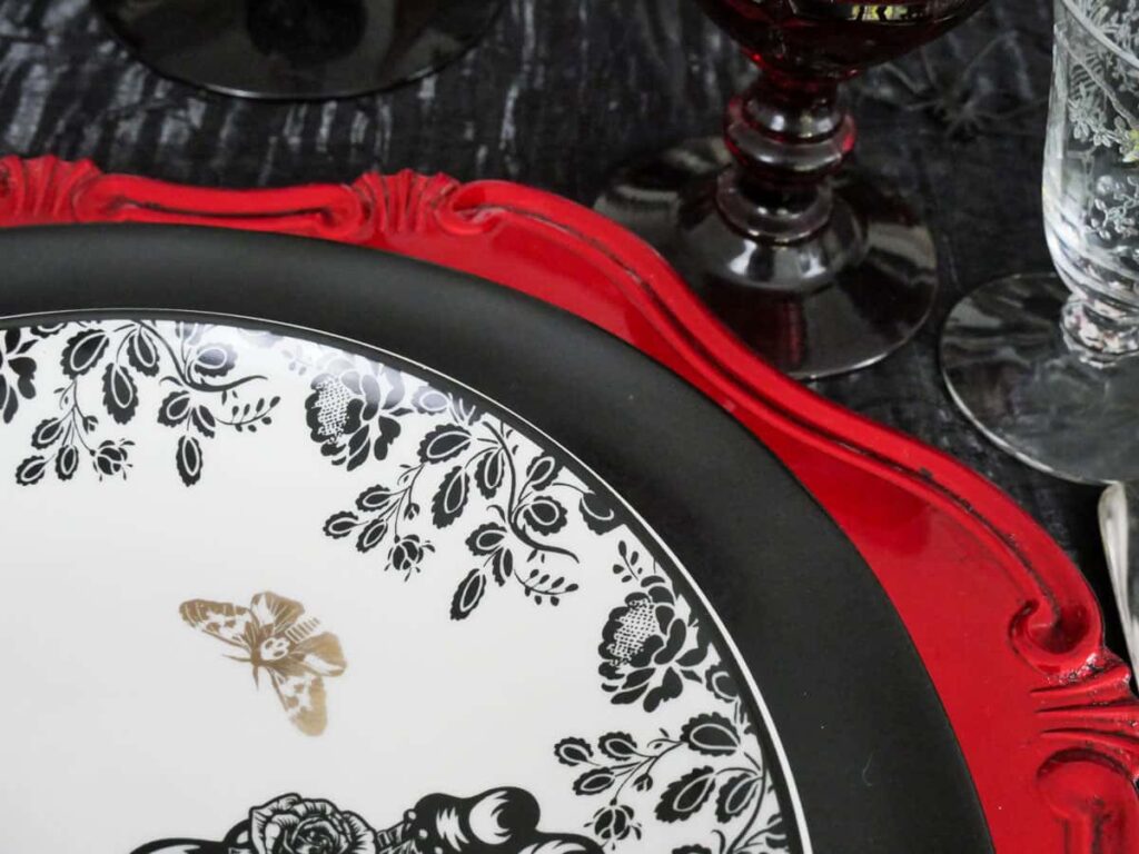 Plate stack for red and black Halloween table setting.